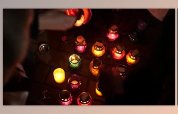 Download Remembrance Day. Holocaust. Terror Victims Memorial. Hands <span class='badge badge-warning'>Lighting</span> Candles. Burning Candles (Videohive 28332272)